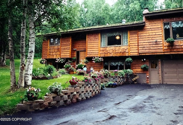 raised ranch featuring a garage