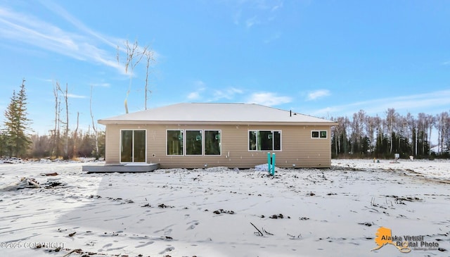 view of snow covered property