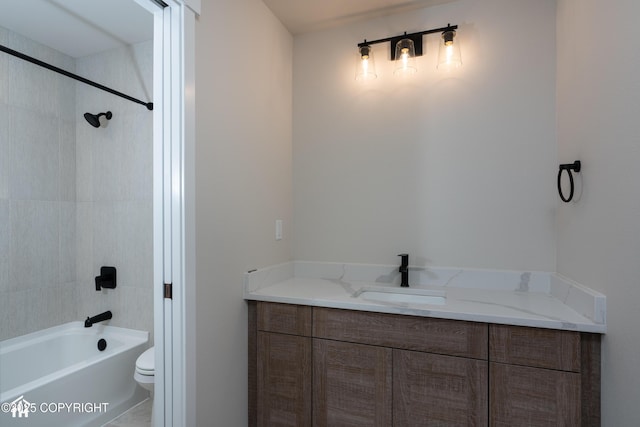bathroom with shower / washtub combination, vanity, and toilet