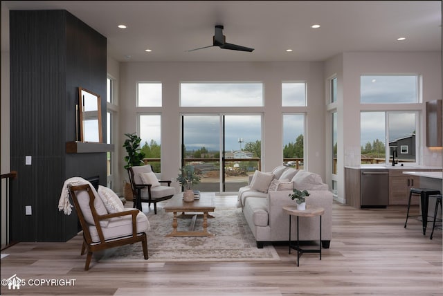11093 Red Sky Cir, Anchorage, AK 99516 - living area with light wood finished floors, recessed lighting, ceiling fan, and a high ceiling