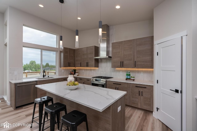 11093 Red Sky Cir, Anchorage, AK 99516 - kitchen with stainless steel appliances, tasteful backsplash, extractor fan, light wood-style floors, and recessed lighting