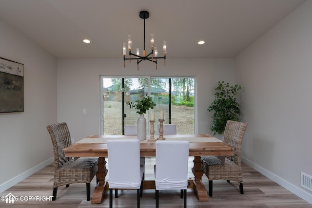 11093 Red Sky Cir, Anchorage, AK 99516 - dining space featuring a chandelier, light wood-type flooring, and recessed lighting