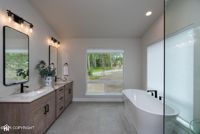 11093 Red Sky Cir, Anchorage, AK 99516 - bathroom featuring double vanity, a soaking tub, and recessed lighting