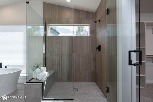 11093 Red Sky Cir, Anchorage, AK 99516 - bathroom featuring a stall shower, vaulted ceiling, and a freestanding tub