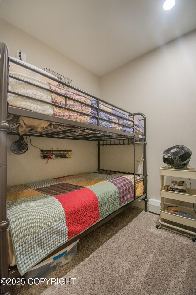 carpeted bedroom featuring baseboards