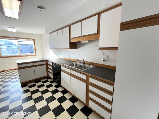 kitchen featuring dishwasher, sink, white cabinets, and kitchen peninsula