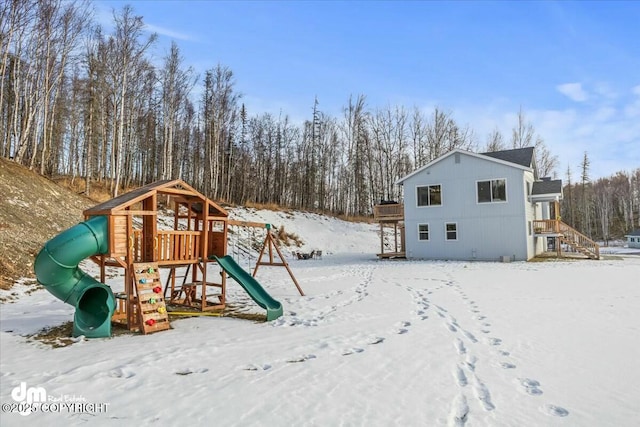 snow covered playground with a playground