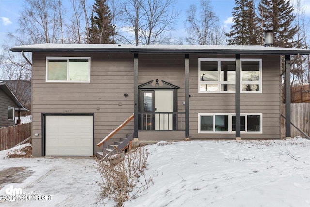 split foyer home featuring a garage