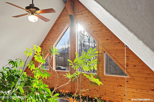 bonus room with lofted ceiling and ceiling fan