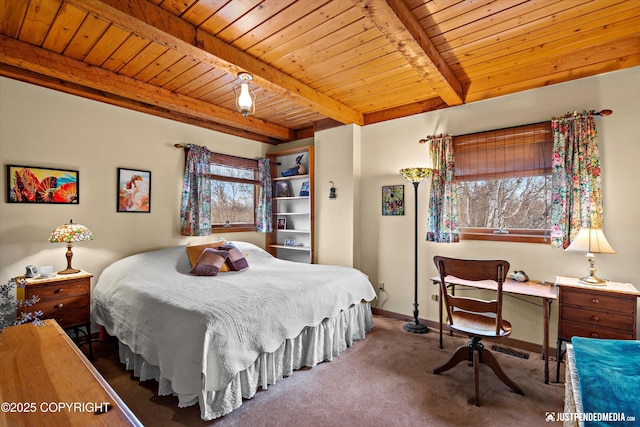 carpeted bedroom with wooden ceiling, beamed ceiling, and baseboards