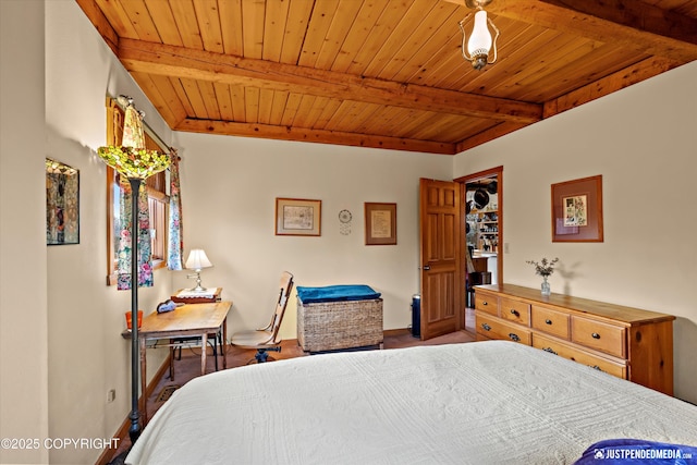 bedroom featuring beamed ceiling, wood ceiling, and baseboards