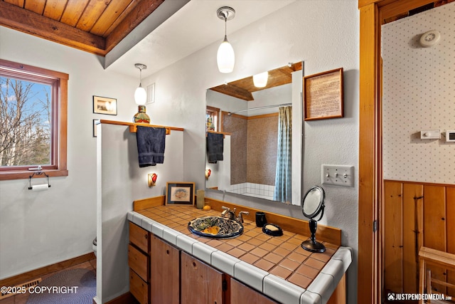 bathroom featuring wooden ceiling, a shower with shower curtain, vanity, and baseboards