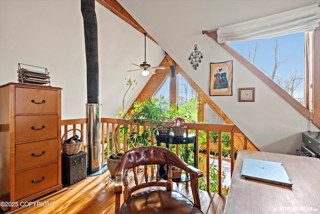 interior space with a ceiling fan and wood finished floors