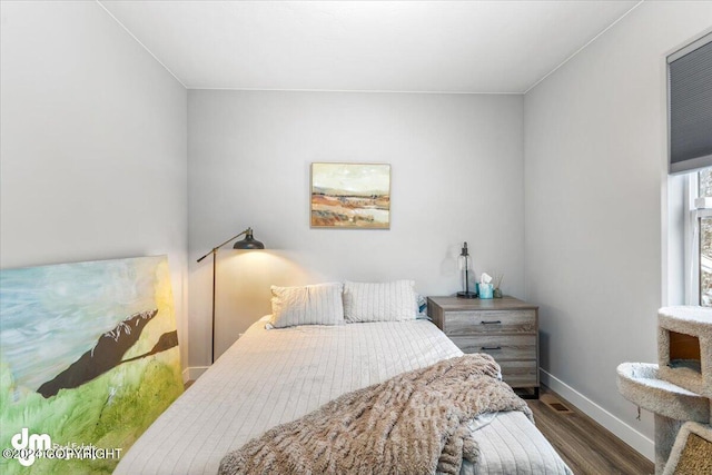 bedroom featuring dark wood-type flooring