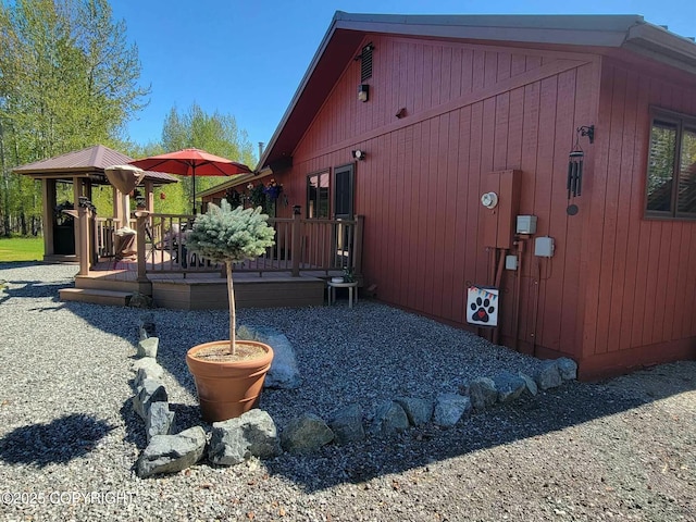 view of side of home with a deck