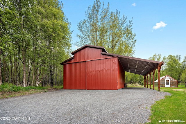 5853 E Edgerton Parks Rd, Palmer, AK 99645 - view of barn with a carport and driveway