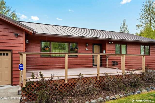 5853 E Edgerton Parks Rd, Palmer, AK 99645 - rustic home featuring a metal roof, a standing seam roof, and a wooden deck