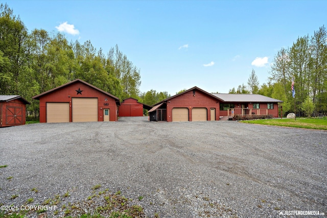 5853 E Edgerton Parks Rd, Palmer, AK 99645 - view of front of property featuring a detached garage and an outdoor structure
