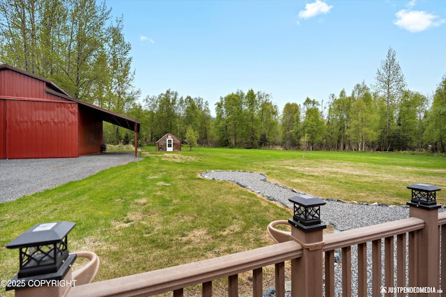 5853 E Edgerton Parks Rd, Palmer, AK 99645 - view of grassy yard featuring an outbuilding