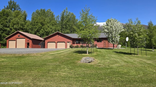 5853 E Edgerton Parks Rd, Palmer, AK 99645 - view of front facade with a front yard, a metal roof, and a standing seam roof
