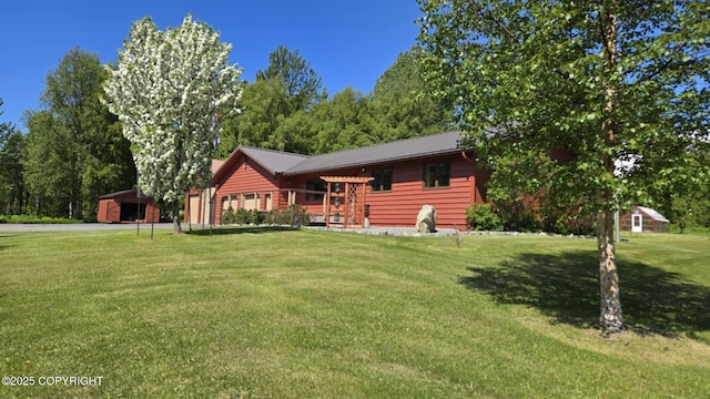 5853 E Edgerton Parks Rd, Palmer, AK 99645 - view of front of home featuring a front lawn and a metal roof