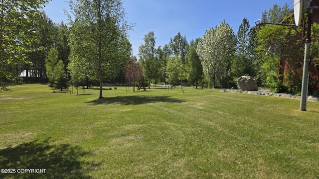 5853 E Edgerton Parks Rd, Palmer, AK 99645 - view of home's community with a lawn