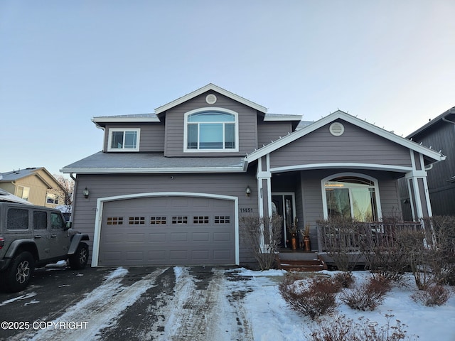 front of property featuring a garage and covered porch