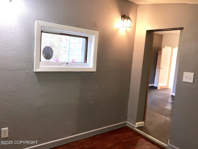 spare room featuring dark wood-type flooring