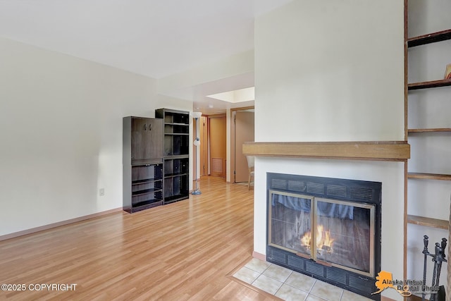 unfurnished living room with wood-type flooring