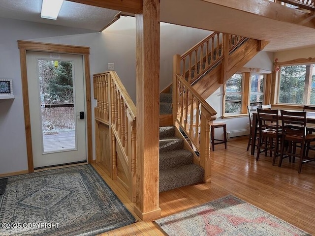 staircase featuring wood finished floors