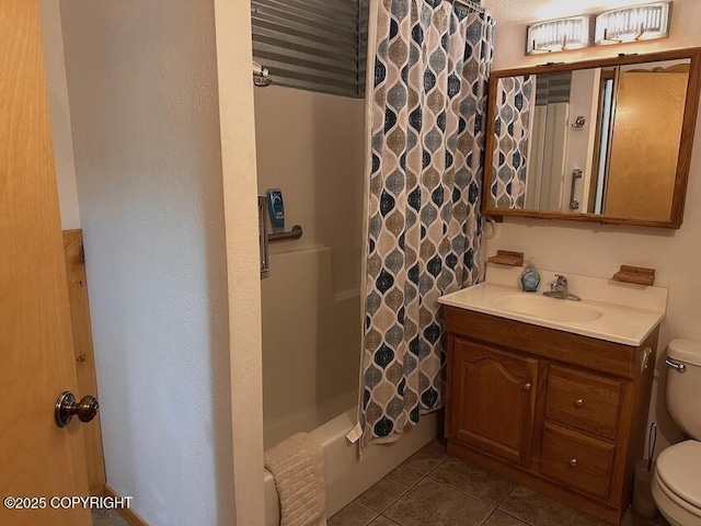 full bath with toilet, vanity, shower / bath combo with shower curtain, and tile patterned floors