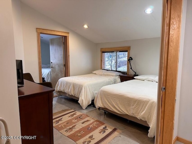 bedroom featuring lofted ceiling and recessed lighting