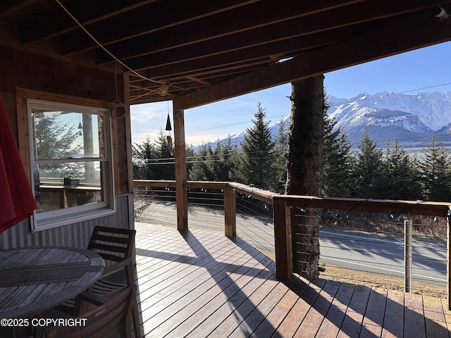 wooden terrace with a mountain view