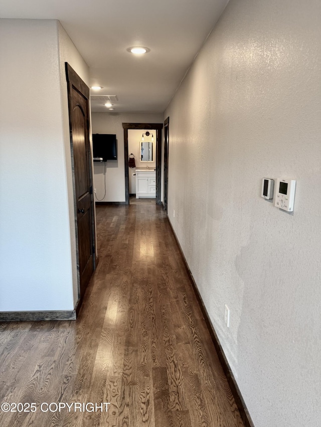 hall with dark hardwood / wood-style floors