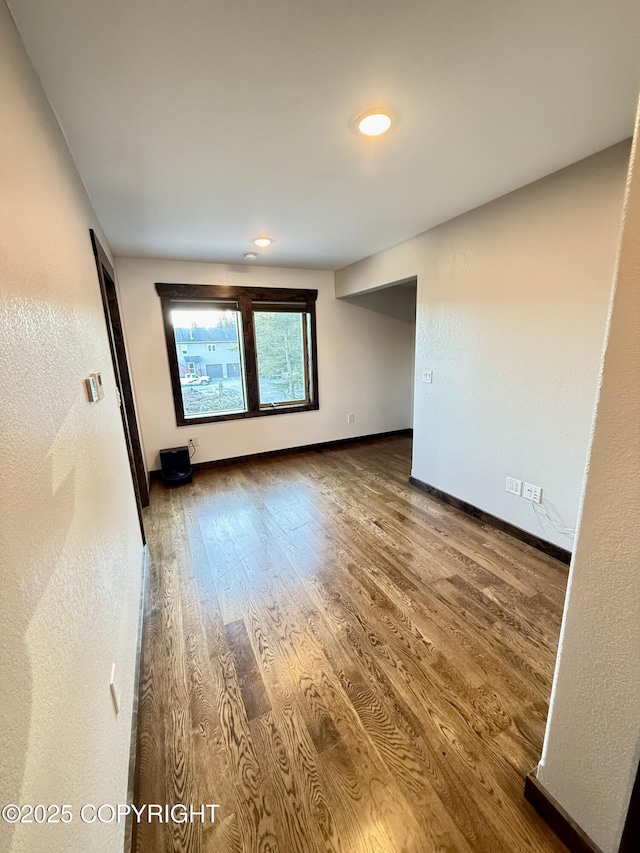 empty room with wood-type flooring