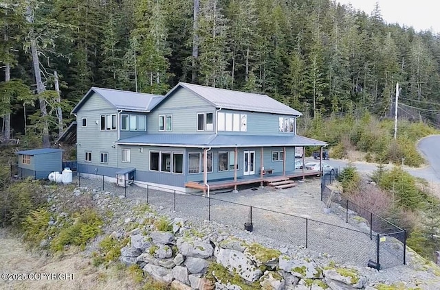 rear view of house with a deck