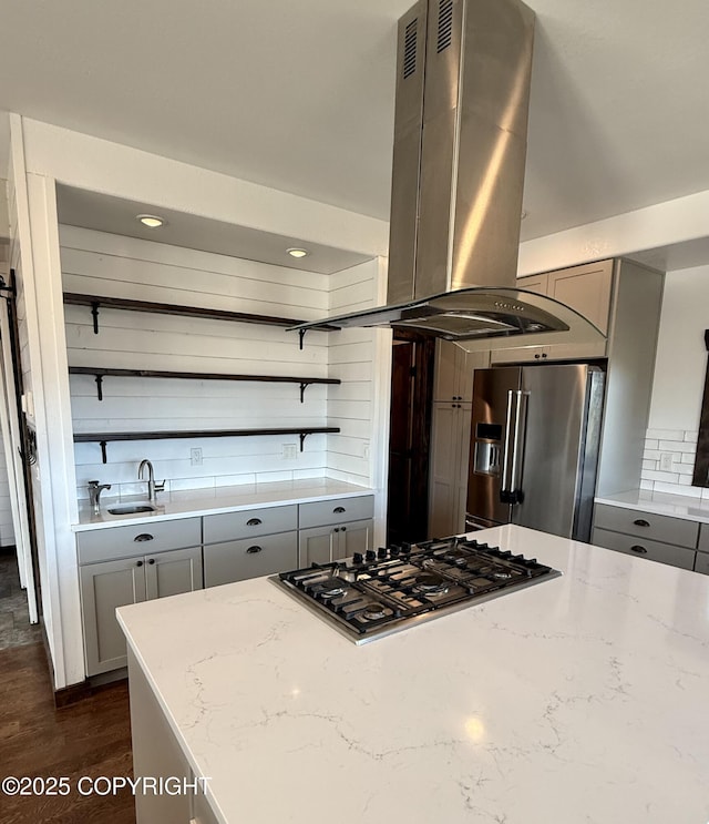 kitchen with light stone counters, appliances with stainless steel finishes, gray cabinets, and sink