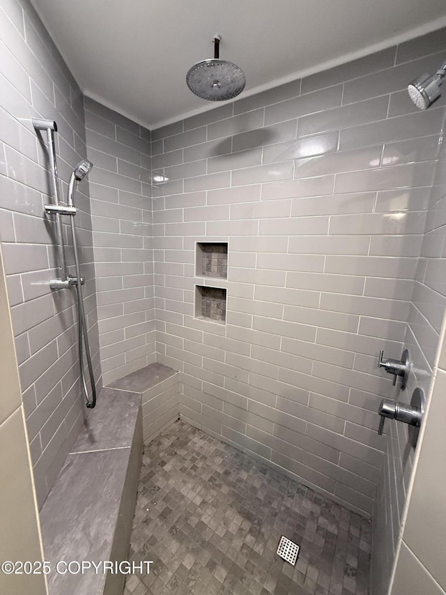 bathroom featuring tiled shower