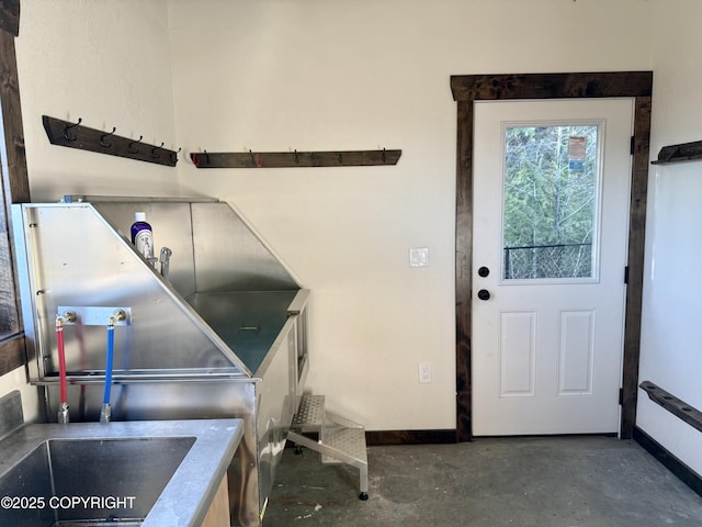 misc room with concrete flooring