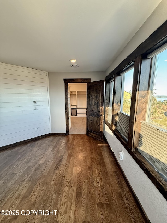 hallway featuring dark wood-type flooring