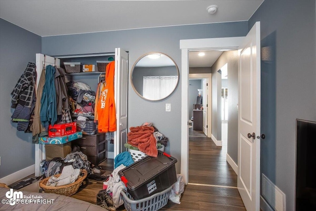 hall with dark hardwood / wood-style floors