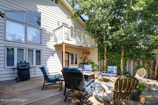 deck with fence and area for grilling