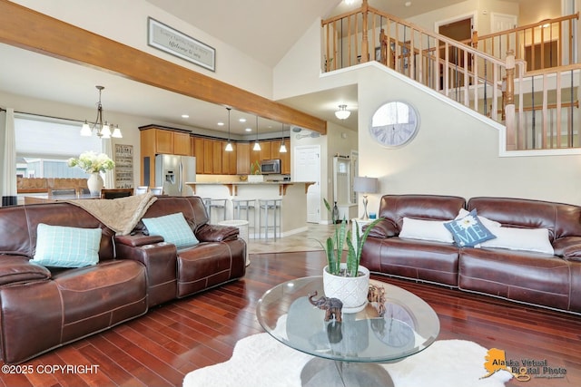 living area with a chandelier, dark wood-style flooring, high vaulted ceiling, beam ceiling, and recessed lighting