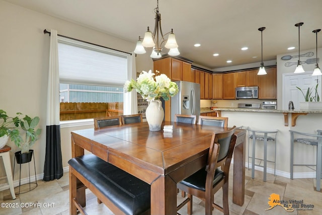 dining room with recessed lighting, baseboards, and light tile patterned flooring