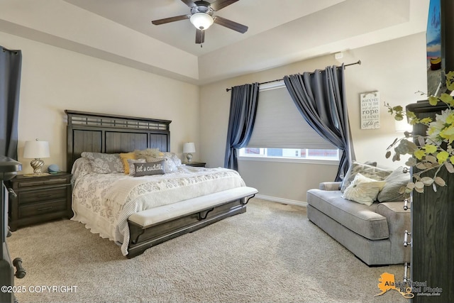 bedroom featuring a ceiling fan, light carpet, and baseboards