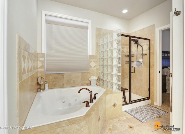 ensuite bathroom featuring a whirlpool tub, tile patterned floors, a shower stall, and ensuite bathroom