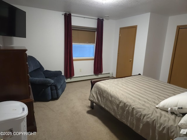 carpeted bedroom with a textured ceiling and baseboard heating