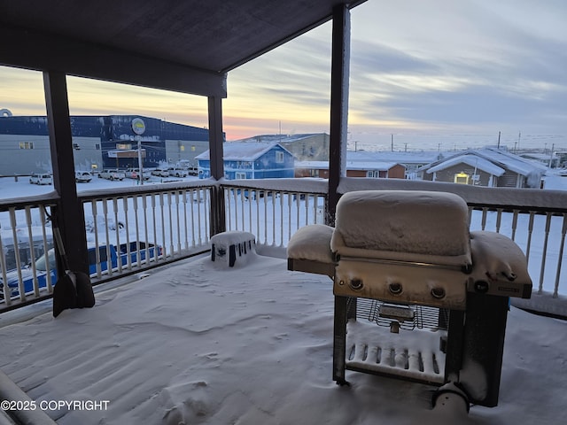 snow covered patio featuring area for grilling