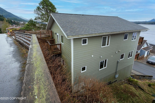 back of property featuring a mountain view