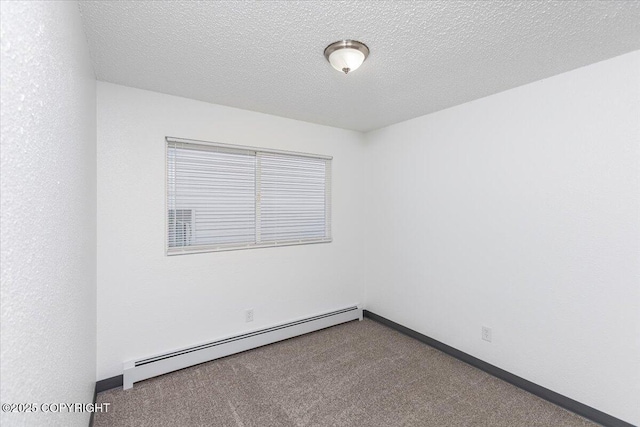 unfurnished room with carpet floors, baseboards, baseboard heating, and a textured ceiling